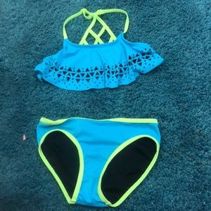 Size 8-10 blue Aztec bathing suit with green trim